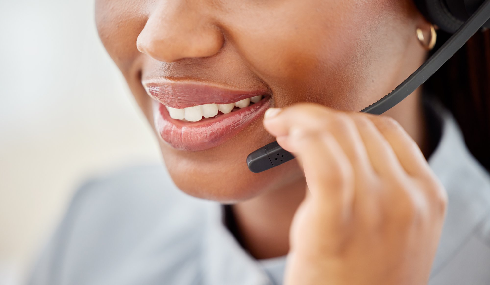 woman-customer-service-mouth-talking-smile-with-headset-telemarketing-call-center-office-african-american-consultant-working-help-desk-support-job-while-consulting-client